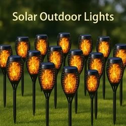 Solar Flaming Lights. Flickering Dancing Torches.  Walkways. Outdoors.  Yards.