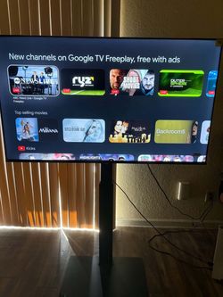 Large Flat Screen Google TV on Stand