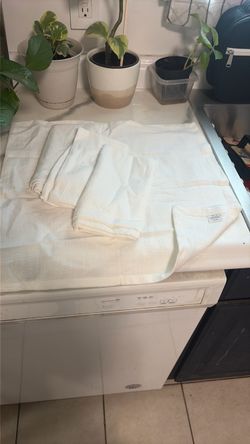 Four pack white cotton napkins