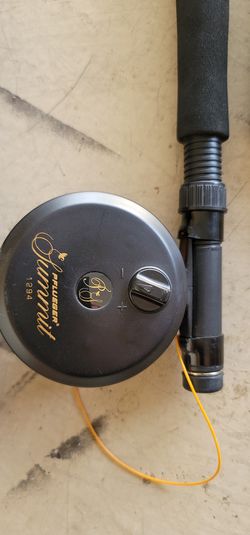 Fishing rod and reel. Like new. Come with box and Fishing stuff