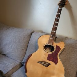 Kona jumbo cutaway body acoustic guitar. 
Playstation and sounds nice.