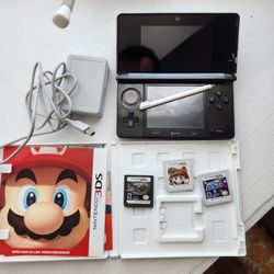 Nintendo 3DS in Black selling with games.