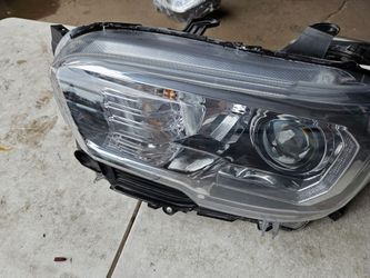 Toyota Tacoma left headlight lid oem