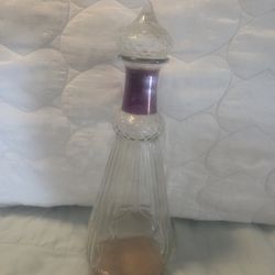 vintage "Jeanie" style glass decanter, often recognized for its appearance in the television show "I Dream of Jeannie".