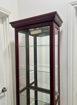 Cherry wood curio cabinet
