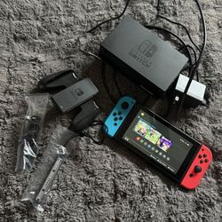 Nintendo Switch With Red And Blue Controllers