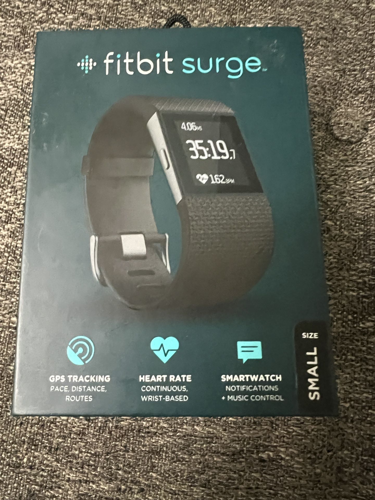 New in box Fitbit Surge