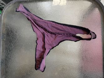A Sexy Pair of Purple Women's Thongs w/ Black Ruffled Trim