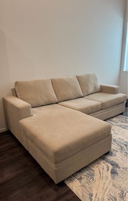Living Spaces Bonaterra Sand Queen Sleeper Sofa with Reversible Chaise