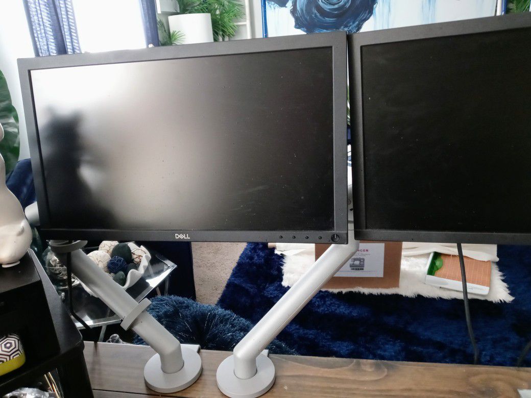 2 Dell Computer Monitors With Adjustable Hook On Arms