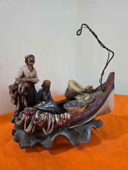 Vintage Mario Garesi Italian terracotta fishing boat nautical sculpture; it is missing a piece (likely a lamp) and has a chip on the bow. Sold as-is.