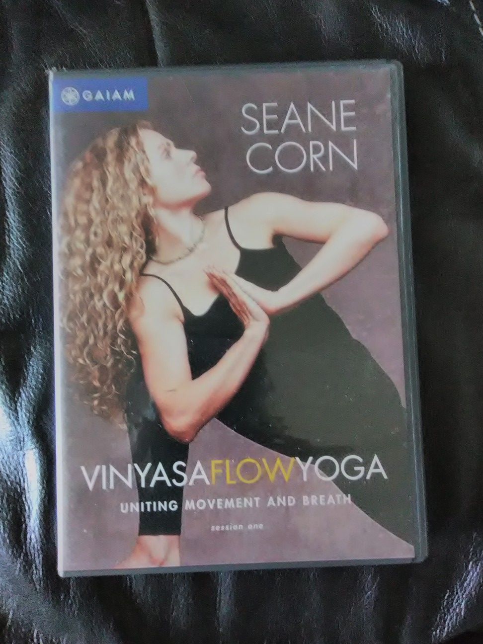 Purple yoga mat w/Sean Corn Flow Yoga lessons 1 and 2, on DVD and Yoga & Pilates on DVD. New Condition. Two DVD's in each Sean Corn case.