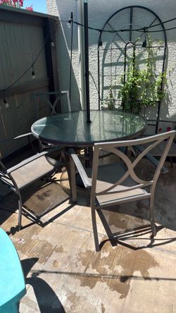 45 inch round glass patio table with four chairs