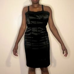 Satin “Feelib” black dress size 6. Corset-like top, ruffle trim w/ a side zipper