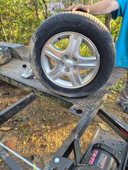 Brand new tires on Ford Taurus aluminum wheels