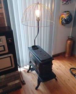 Vintage cast iron stove lamp. 2 of them available $250 for both