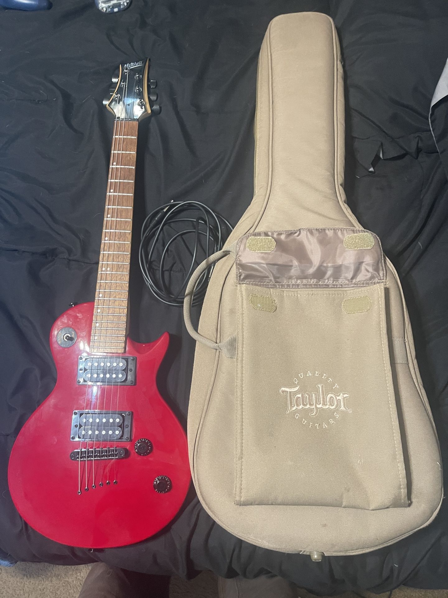 Mitchell MS100 guitar with Taylor soft case and amp cable
