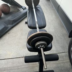 5lb Standard Bar With 75lbs And Adjustable Bench.  6 Different Angles. 80$