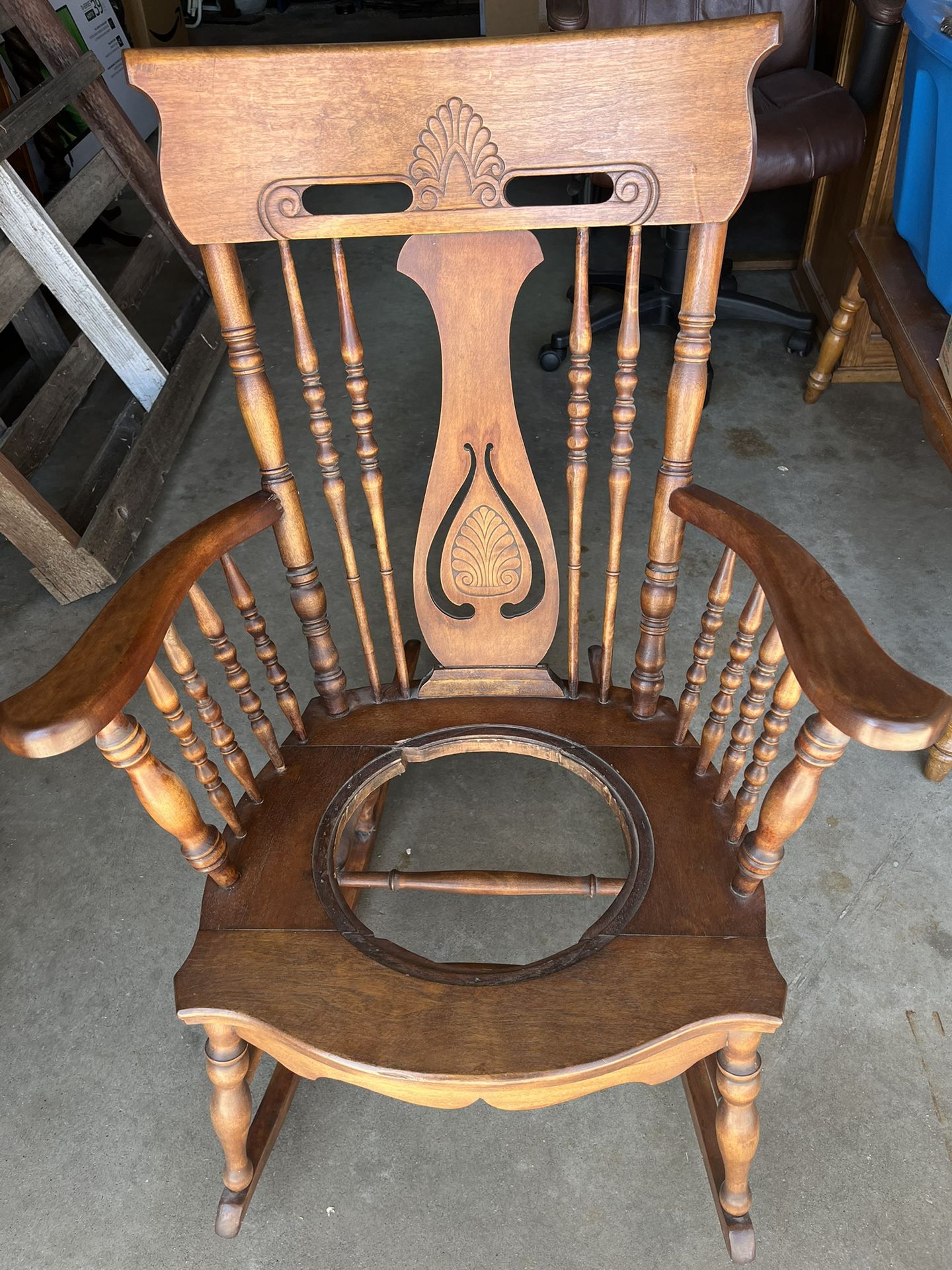 Vintage Oak Rocking Chair. In very good preowned condition.  For its age, the chairs finish is good. It is missing the seat which may have been wicker