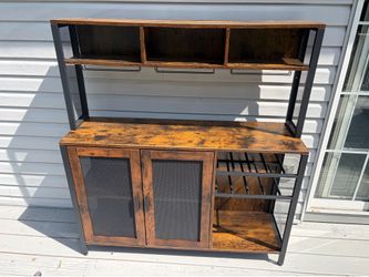 Brand New Wine Bar Cabinet just took out of the box and assembles a little too small for me. $135