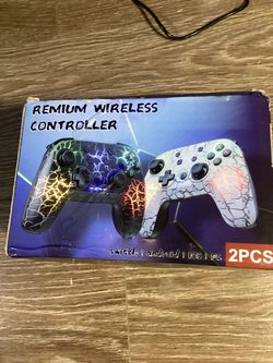New Two Nintendo Switch wireless game controllers with cracked-texture designs and RGB lightning effects. Top controller is black with multicolor glow