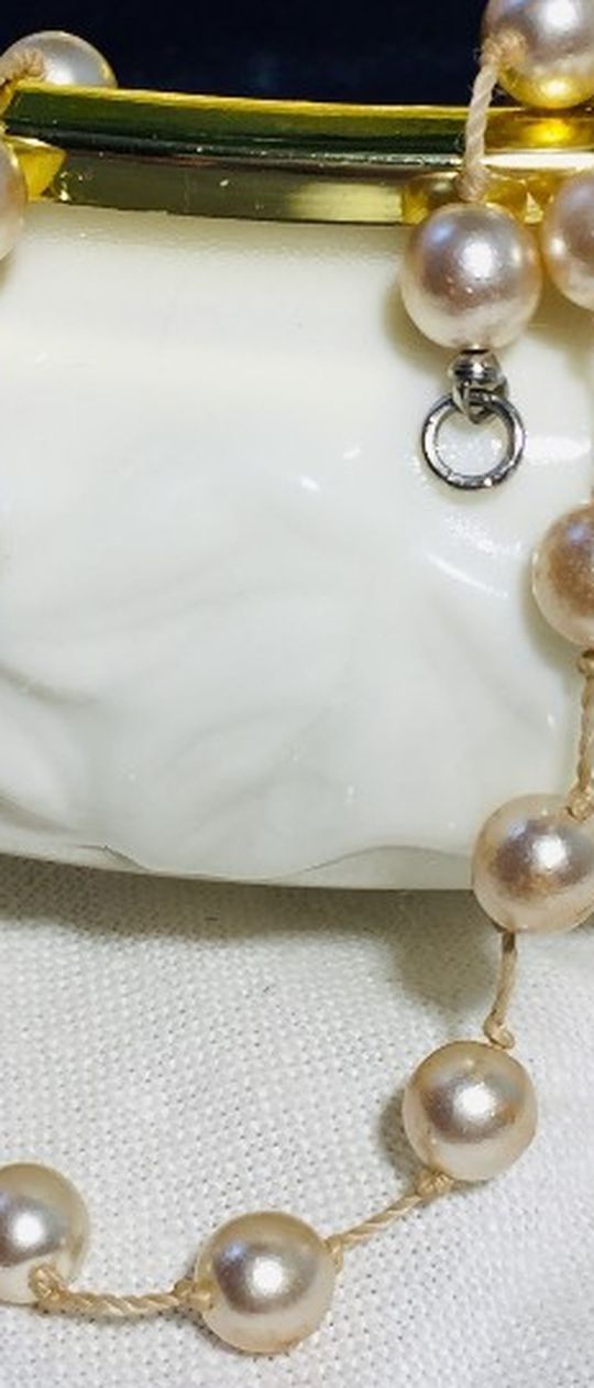 Vintage pearl necklace. This necklace has been in our family for at least 50 years, which I remember. It belonged to my great grandmother. They wer