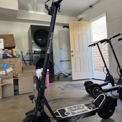 Electric scooter with shock absorber