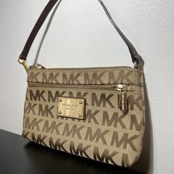 MICHAEL KORS. MINI POUCH.  $120