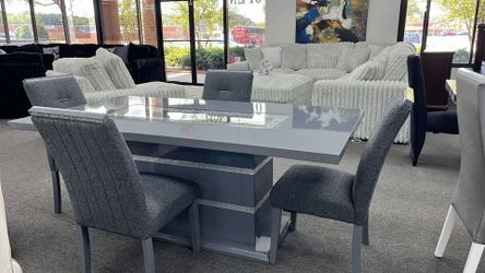 Elegant high gloss grey finish dining set with a clear glass inlay to round off the look