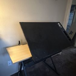 Adjustable drafting table