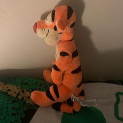 One orange Disney tiger plush toy. 