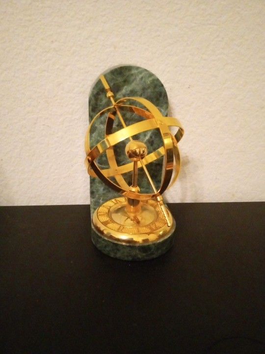 Single 7" Brass Armillary Sundial/Sphere Bookend on Green Marble Base.