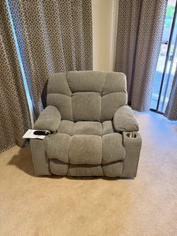 Power Recliner Lays flat for sleeping and stands you up.