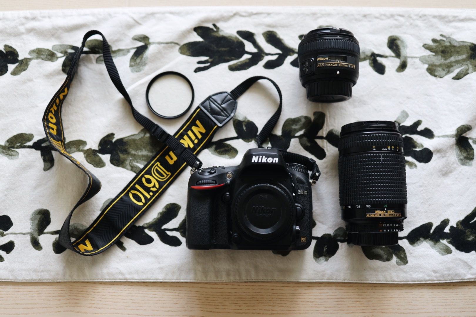 Nikon D610 Camera, 2 Camera Lenses, 1 UV Filter, and Camera Bag