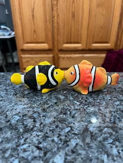 Westland Fish Kissing Magnetic Pair of Salt and Pepper Shakers. Preowned never used. Had been on display in a cabinet with a very large salt and pep