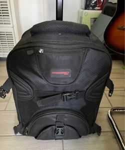 Photography backpack with wheels and tripod holder Many pockets and customizable storage for lenses etc.