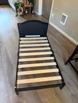 Barely used toddler bed frame and brand new toddler mattress