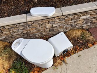 Glacier Bay 12 in. Rough In 2-Piece 1.28 GPF Single Flush Round Toilet in White, Seat Included