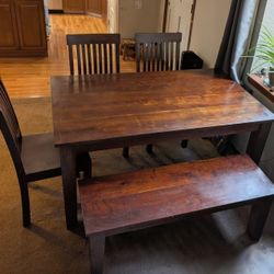 Heavy Wood Table, 3 Chairs, And A Bench.