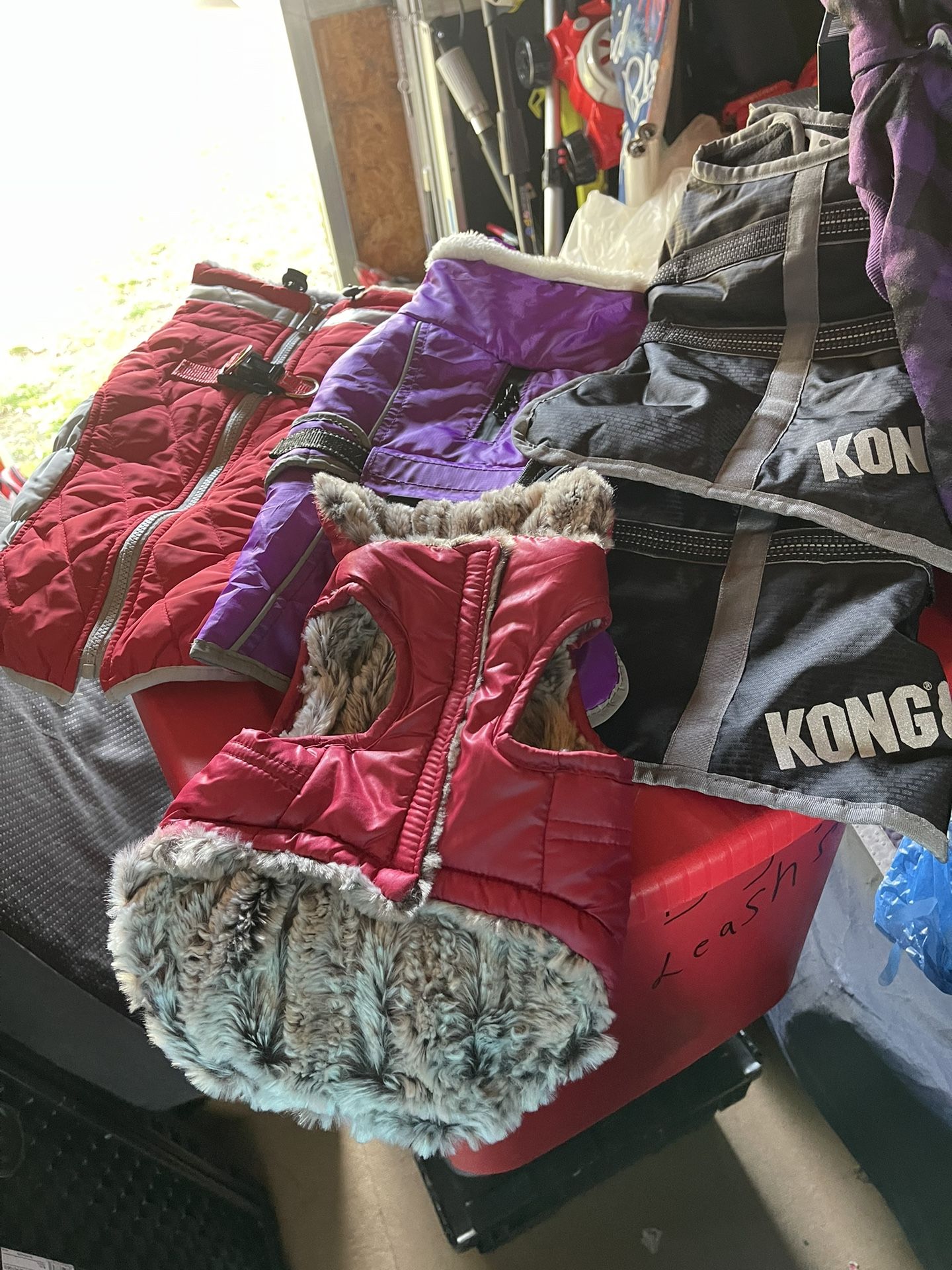 Assorted dog coats from extra small to a 6X
