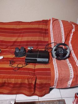PlayStation 3 with the camera and steering wheel and gas and brakes in great condition