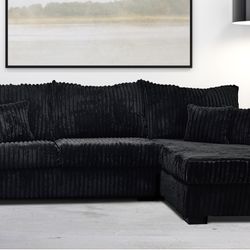 Black Sectional Covered In Soft Corduroy Fabric 