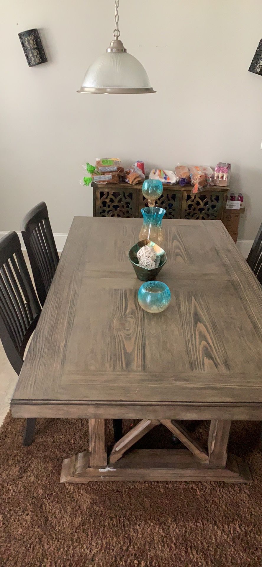 Breakfast table with 4 chairs one has a broke piece on back of one chair
