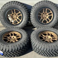 17” Gold Wheels Rims and Tires Chevy Silverado Tahoe Suburban GMC Sierra Yukon Denali LT285/70R17 MT