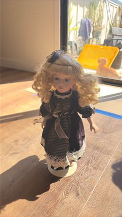 Blonde porcelain doll party girl