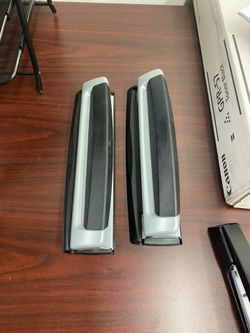 Gray metal three hole puncher