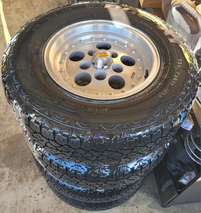 CHEVY OBS RIMS AND TIRES 235/75/15 KELKY EDGE AT TIRES 5 LUGS