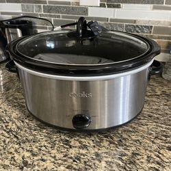 Cooks 6.0 QT slow cooker. Model 6000-SS. Stainless steel exterior with glass lid and ceramic insert. Has Off, Low, High, Warm settings. Easy to use fo