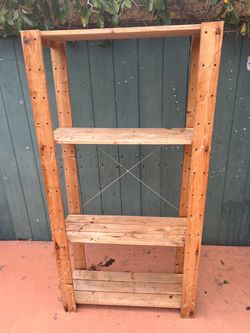 Tall wooden shelving unit