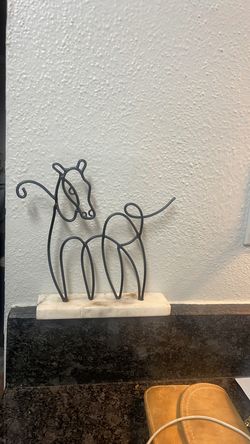 Iron horse decor piece set on marble base